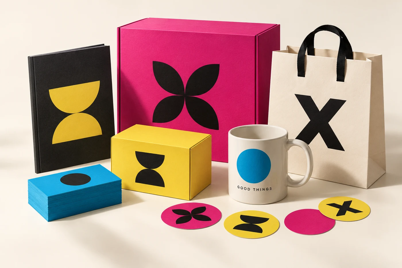 Colourful custom packaging, business cards, printed mug and paper bag in cyan, magenta, yellow and black